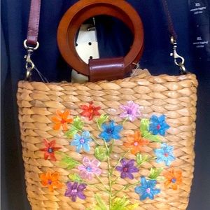 Straw purse with flowers, green cloth interior ,brand new with tags.